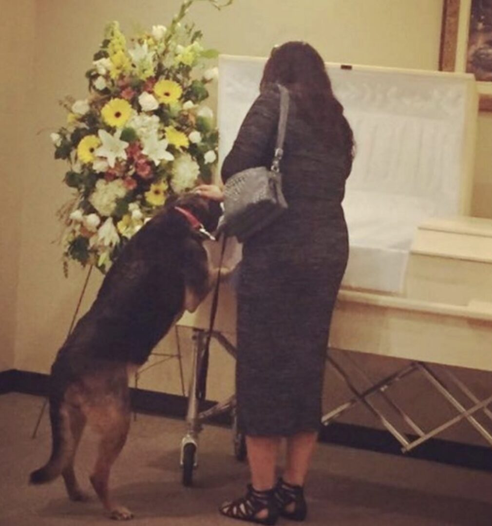 Sadie at the owner's funeral